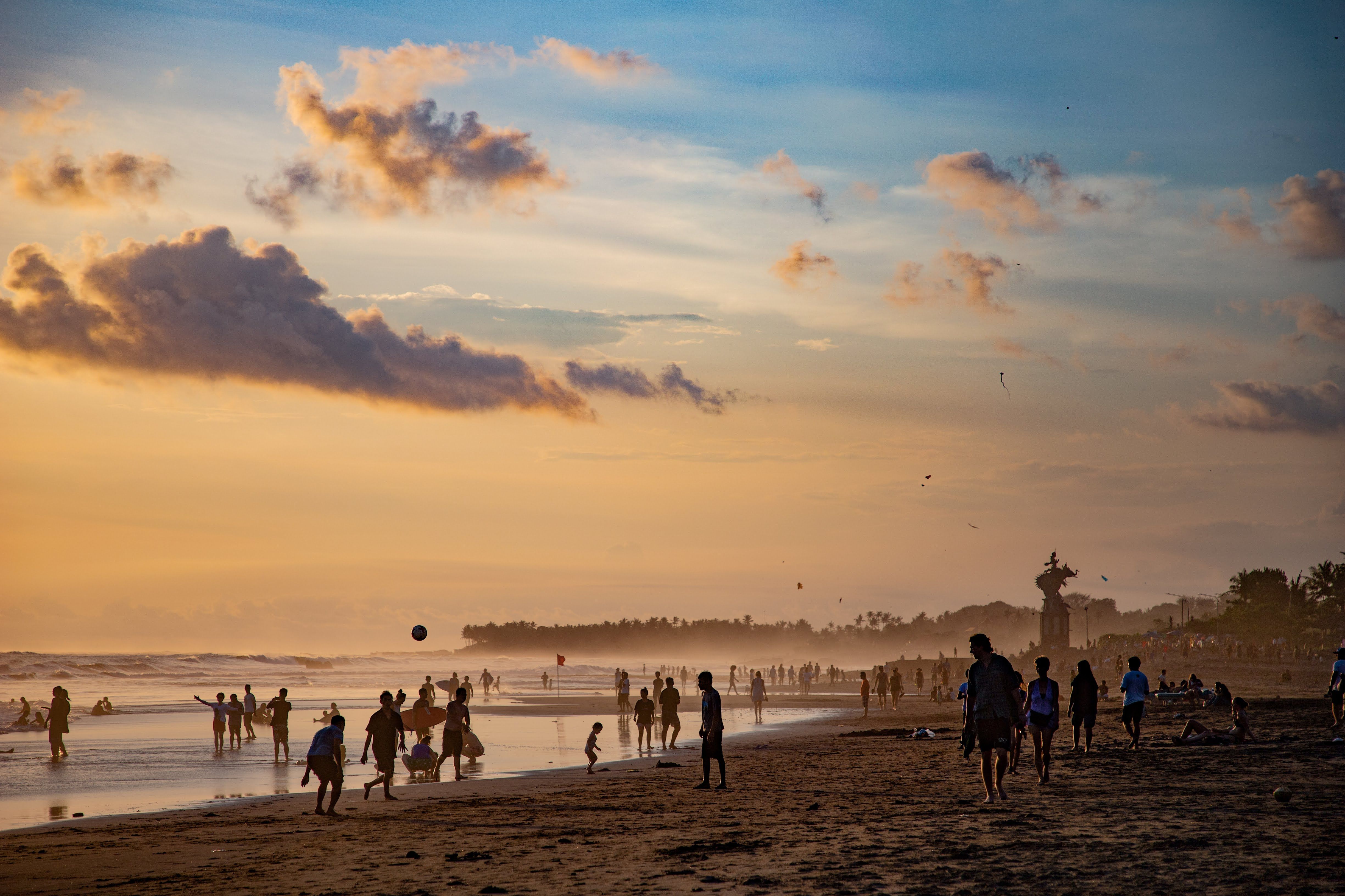 Sunset scene at Canggu Beach, Bali, where people gather after the working day